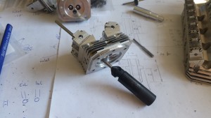 Cutting the valve seats with a home-made tool.